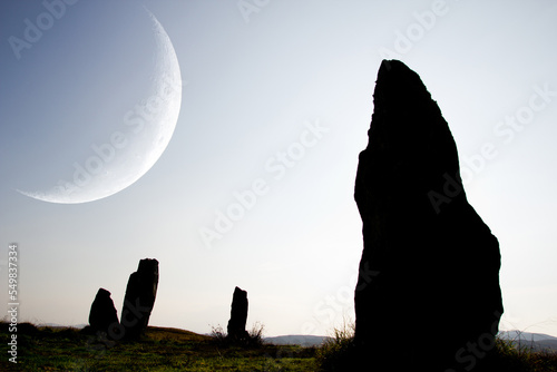 Stone Circle and a crescent moon at Callanish, Isle of Lewis, Scotland photo