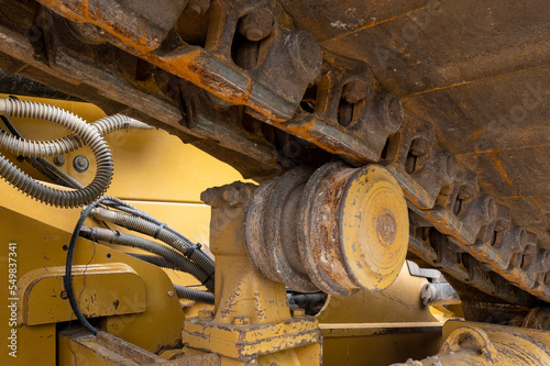 Close up of idler wheel and track of construction bulldozer