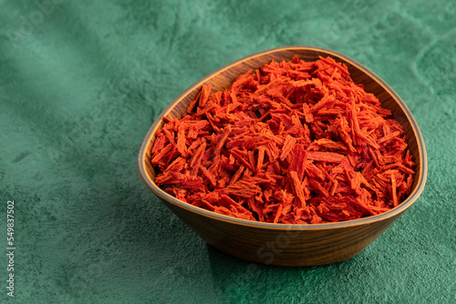 Solanum lycopersicum - Dehydrated dried tomato flakes in the bowl