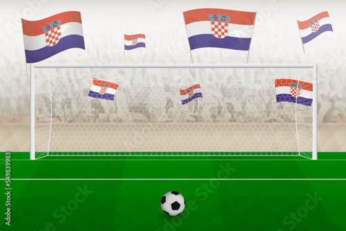 Croatia football team fans with flags of Croatia cheering on stadium, penalty kick concept in a soccer match.