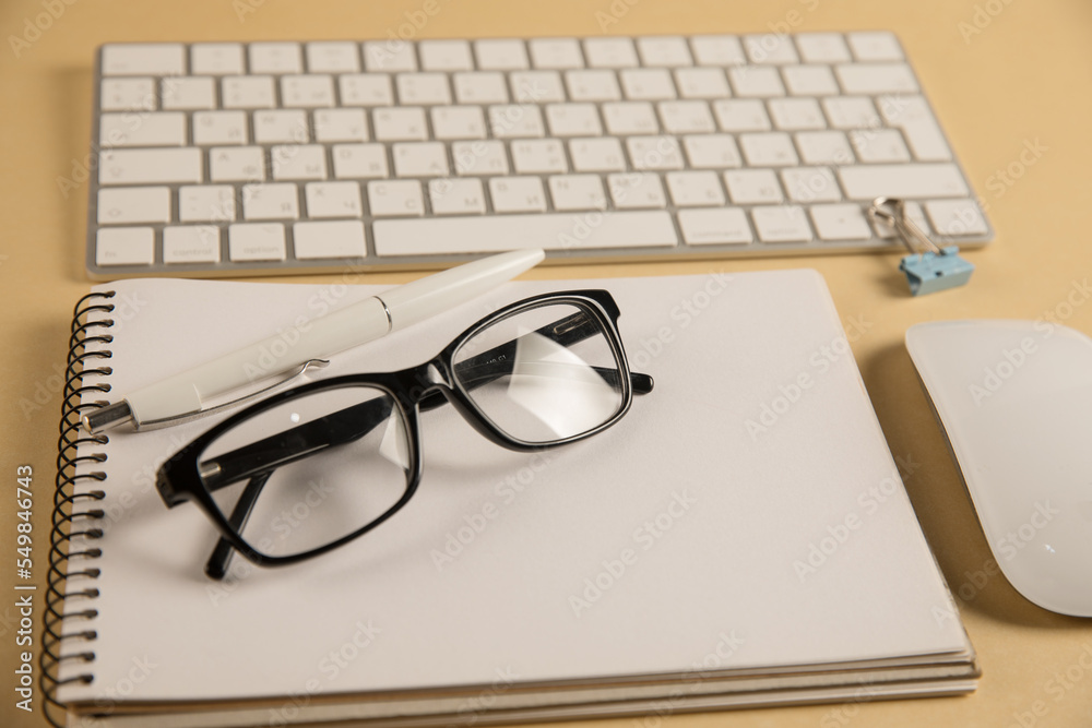Keyboard, glasses and notepad Keyboard, glasses and notepad