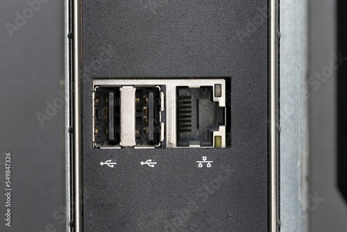 Closeup shot of firewire and small inputs on a digital computer workstation photo