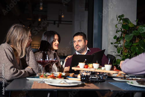 Group of Happy friends having lunch in the restaurant