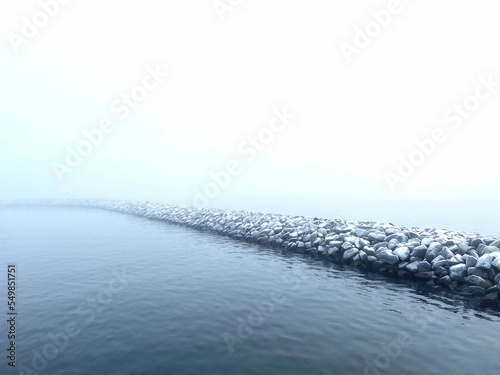 Photography Fog over breakwater made of giant boulders in Copenhagen, Denmark