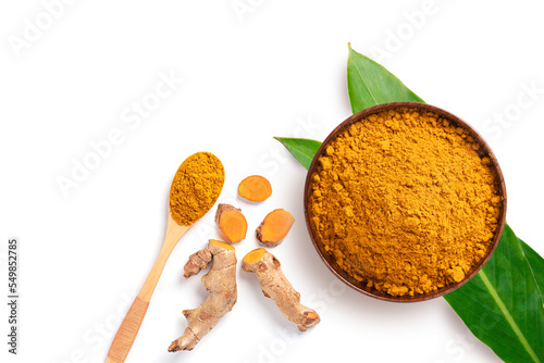 Fototapeta Naklejka Na Ścianę i Meble -  Spices and herbs , Turmeric powder in wooden bowl and spoon  isolated on white background. Top view