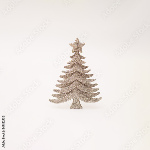 Silver glitter decorative Christmas tree on a white background.