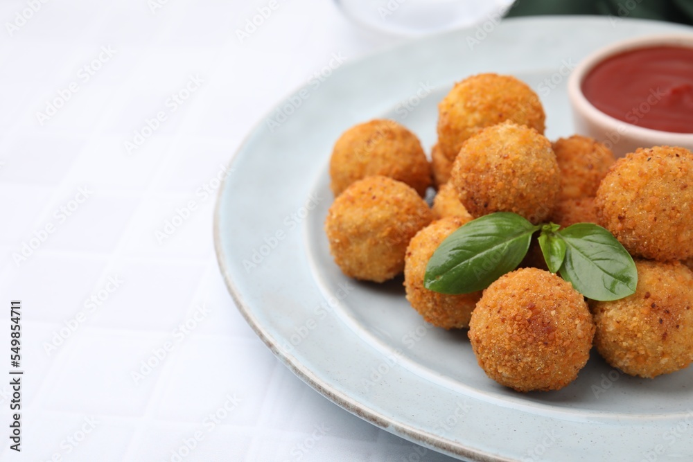 Delicious fried tofu balls with basil and ketchup on white tiled table, closeup. Space for text Delicious fried tofu balls with basil and ketchup on white tiled table, closeup. Space for text