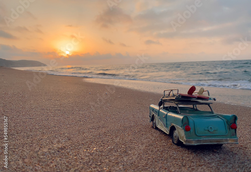 Photography Blue toy car drive on the beach