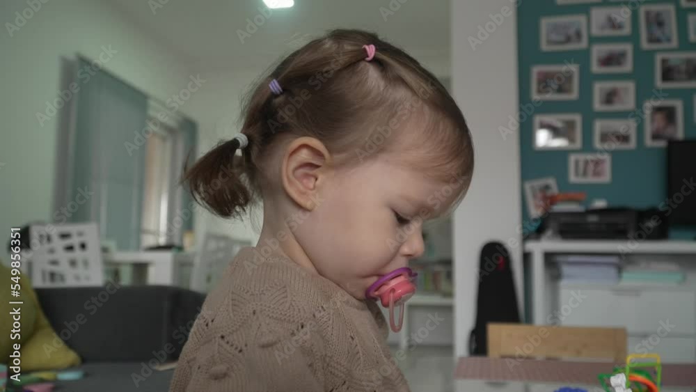 One child small caucasian girl toddler play at home alone One child small caucasian girl toddler play at home alone
