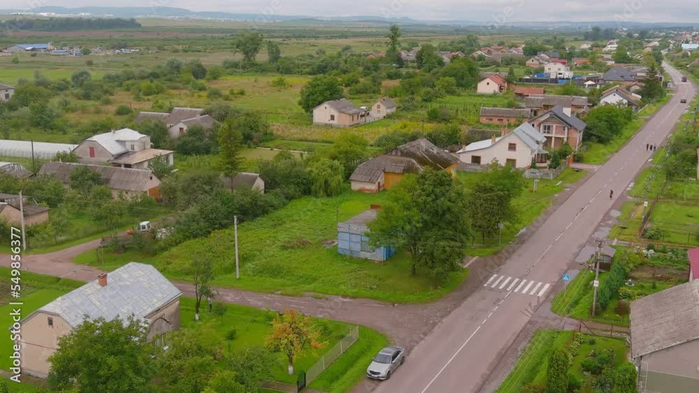 Domestic tourism. Ukraine small village at sunrise in summer. Aerial view of beautiful landscape. little settlement at sunrise in summer. Aerial view of beautiful Ukraine small town at summertime. Domestic tourism. Ukraine small village at sunrise in summer. Aerial view of beautiful landscape. little settlement at sunrise in summer. Aerial view of beautiful Ukraine small town at summertime.