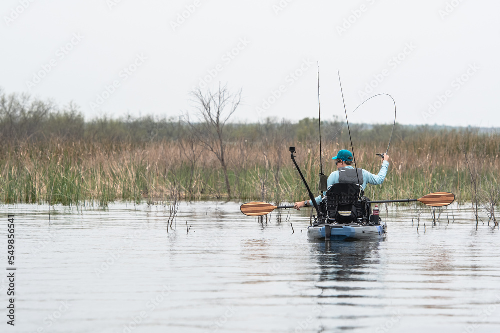 Catching bass at Possum Kingdom Texas from kayak Catching bass at Possum Kingdom Texas from kayak