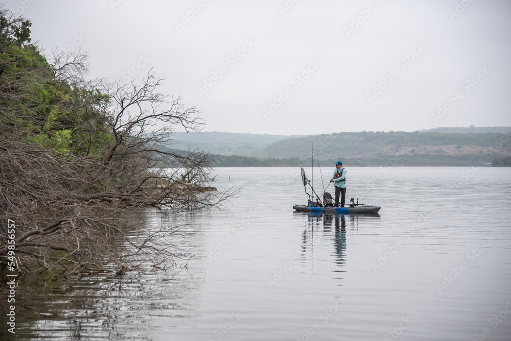 Kayak Angler bass fishing laydowns on Possum Kingdom Lake in Texas Kayak Angler bass fishing laydowns on Possum Kingdom Lake in Texas