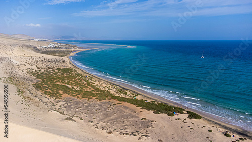 Aerial view of the Sotavento beach in the south of Fuerteventura in the Canary Islands, Spain - Sand strip in the Atlantic Ocean among a desertic barren landscape