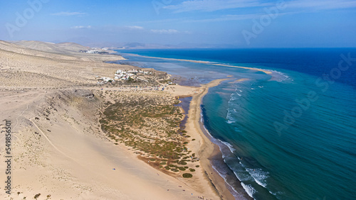 Aerial view of the Sotavento beach in the south of Fuerteventura in the Canary Islands  Spain - Sand strip in the Atlantic Ocean among a desertic barren landscape