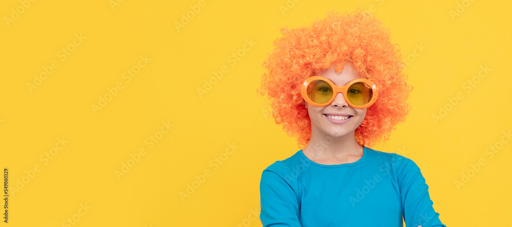 pleasant smile. happy childhood. girls birthday party. happy funny kid in curly wig. time for fun. Funny teenager child in wig, party poster. Banner header, copy space. pleasant smile. happy childhood. girls birthday party. happy funny kid in curly wig. time for fun. Funny teenager child in wig, party poster. Banner header, copy space.