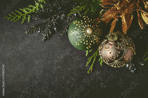 An arrangement of vintage Christmas decorations on black background. Flat lay. Copy space