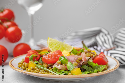 Plate of salad with mung beans on white table © New Africa