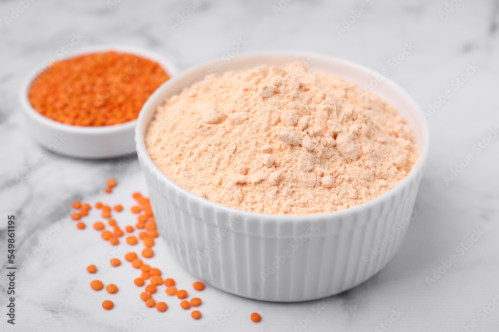 Lentil flour and seeds on white marble table, closeup Lentil flour and seeds on white marble table, closeup