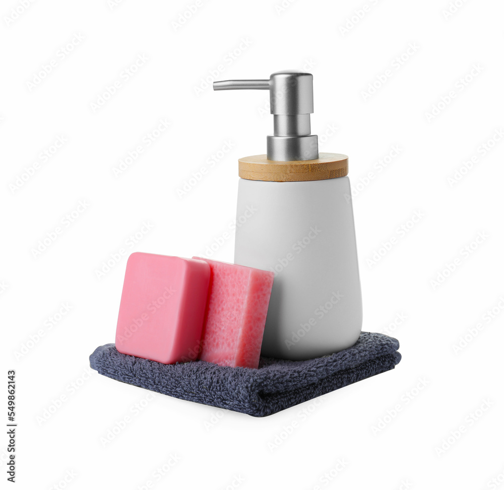 Soap bars, dispenser and terry towel on white background Soap bars, dispenser and terry towel on white background