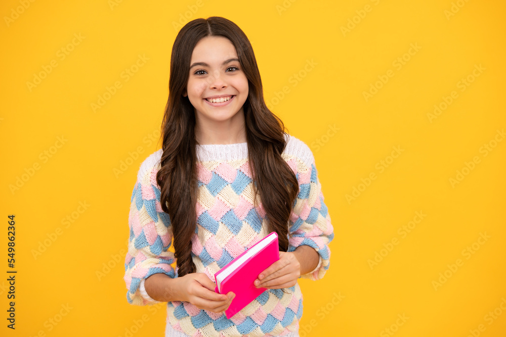 Schoolgirl with copy book posing on isolated background. Literature lesson, grammar school. Intellectual child reader. Schoolgirl with copy book posing on isolated background. Literature lesson, grammar school. Intellectual child reader.
