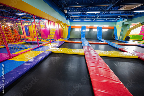 Set of trampolines at indoor play center playground.