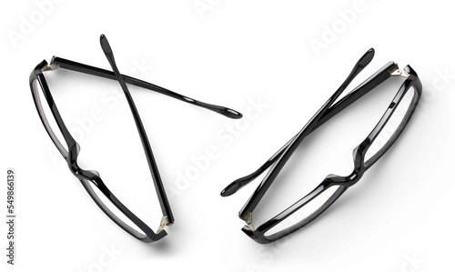 contemporary / modern pair of black hipster glasses in two different positions, business / lifestyle design elements isolated over a transparent background, top view / flat lay for your desk scenes