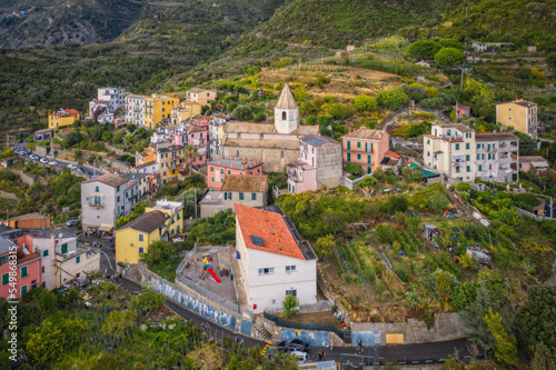 Aerial view of Corniglia and coastline of Cinque Terre,Italy.UNESCO Heritage Site.Picturesque colorful village on rock above sea.Italian Riviera landscape.Steep cliff.September 2022