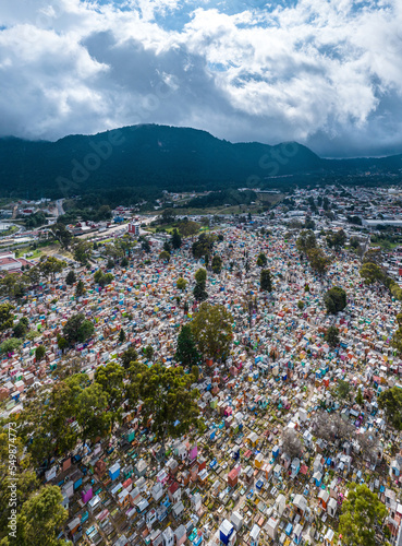 Aerial view of a very colorful cemetery in the mountains. Sunset. Panorama.