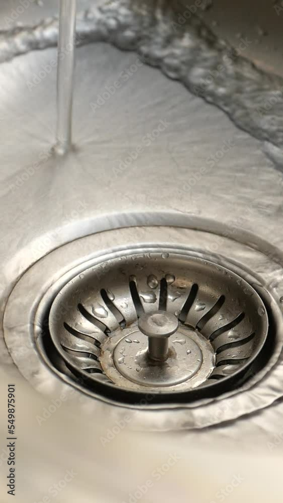 water pouring from a faucet tap slow motion water pouring from a faucet tap slow motion