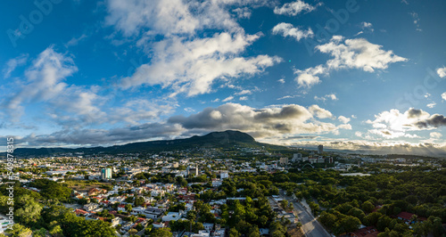 Fototapeta Naklejka Na Ścianę i Meble -  Aerial view of a big mountain at sunset. The beautiful city of Tuxtla Gutierrez in Mexico. Panorama.