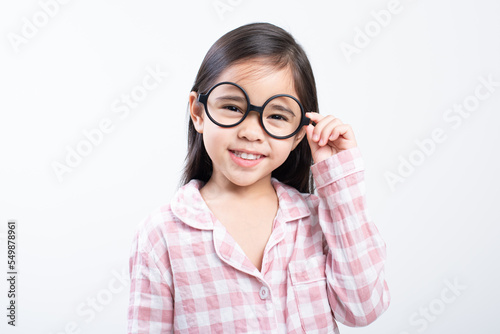 little girl asian wearing glasses, pink shirt, white background