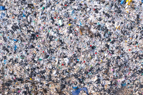 Top view. Lots of plastic bottles and rubbish. waste sorting site The concept of waste disposal and waste sorting to protect the environment. © Photo Sesaon