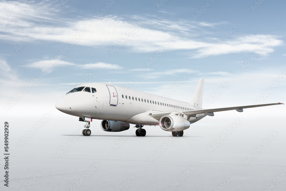 White passenger airplane isolated on bright background with sky White passenger airplane isolated on bright background with sky