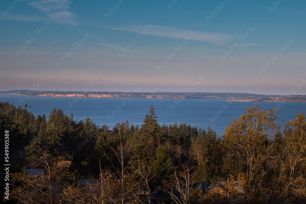 2022-11-28 VIEW OF WHIDBEY ISLAND FROM CAMANO ISLAND WITH A NICE SKY AND EVERGREEN TREES IN THE FOREGROUND