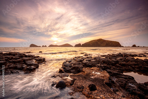 Landscape with Chagwido Island and strange volcanic rocks, view from Olle 12 corse in Jeju Island, Korea. photo
