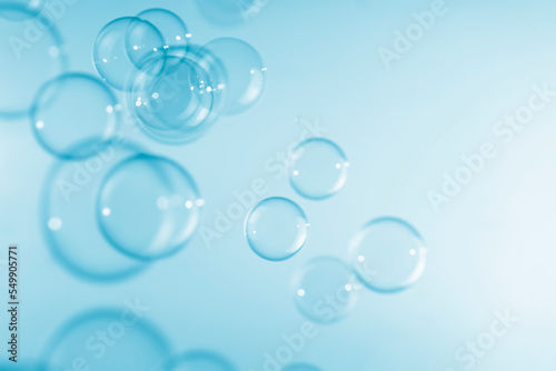 Abstract Transparent Blue Soap Bubbles Background. Freshness Soap Sud Bubbles Water