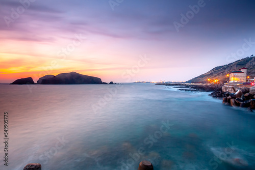 Landscape with Chagwido Island and strange volcanic rocks, view from Olle 12 corse in Jeju Island, Korea. photo