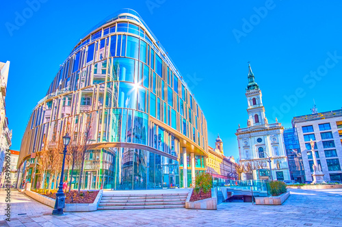Panoramic view on Szervita square with historic St Anna Parish Church and modern glass office building, Budapest, Hungary
