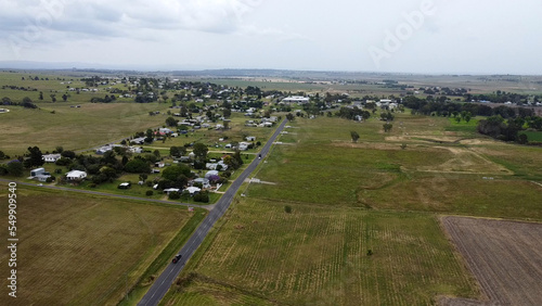 Beautiful scenery of the country town of Killarney in Queensland, Southern Downs Region, showing houses, fields, grass and mountains