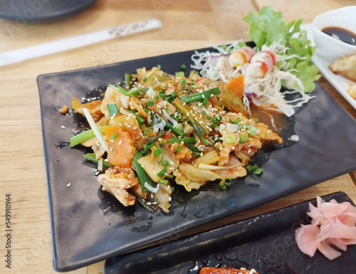 Korean Pork Belly Kimchi Stir Fry (Dwaejigogi Kimchi Bokkeum) Super savory, fatty, meaty, and juicy. It has the spices and tanginess from the kimchi, the fat and savory taste from the pork belly. photo