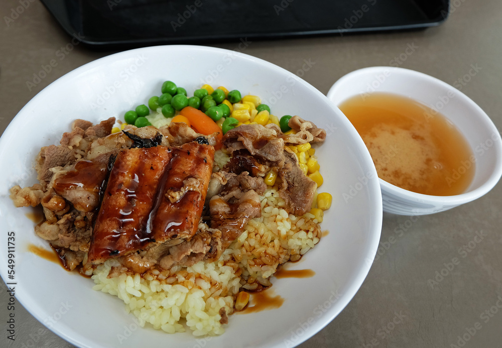 Close up Unagi Don, Grilled Eel Rice Bowl served with barbecue beef and miso soy soup