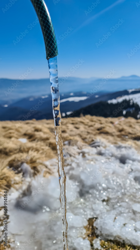 Fresh drinking water coming out of pipe next to Wolfsberger Huette on ...