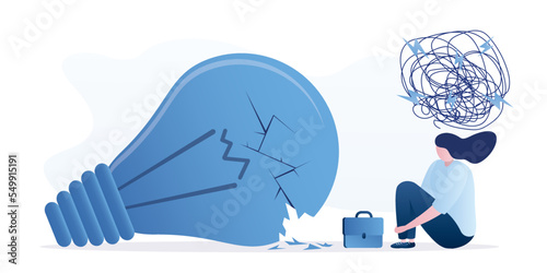 Unsuccessful brainstorming, concept. Overcoming difficulties with new ideas, lack of creativity. Unhappy businesswoman sitting near extinguished and broken light bulb. Mental crisis.