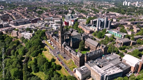 Aerial shot pulling back from Glasgow University over Kelvingrove Park on a sunny day photo