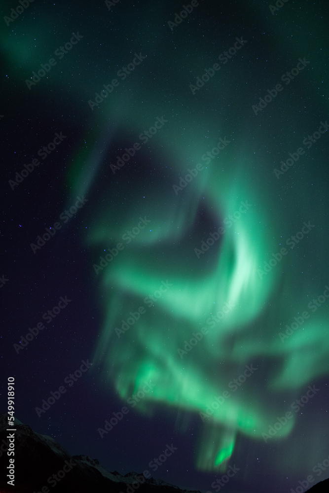 Aurora borealis in the starry night sky over the lake Aurora borealis in the starry night sky over the lake