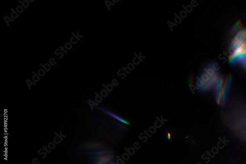 Blur colorful rainbow crystal light leaks on black background. Defocused abstract multicolored retro film lens flare bokeh analog photo overlay or screen filter effect. Glow Vintage prism colors