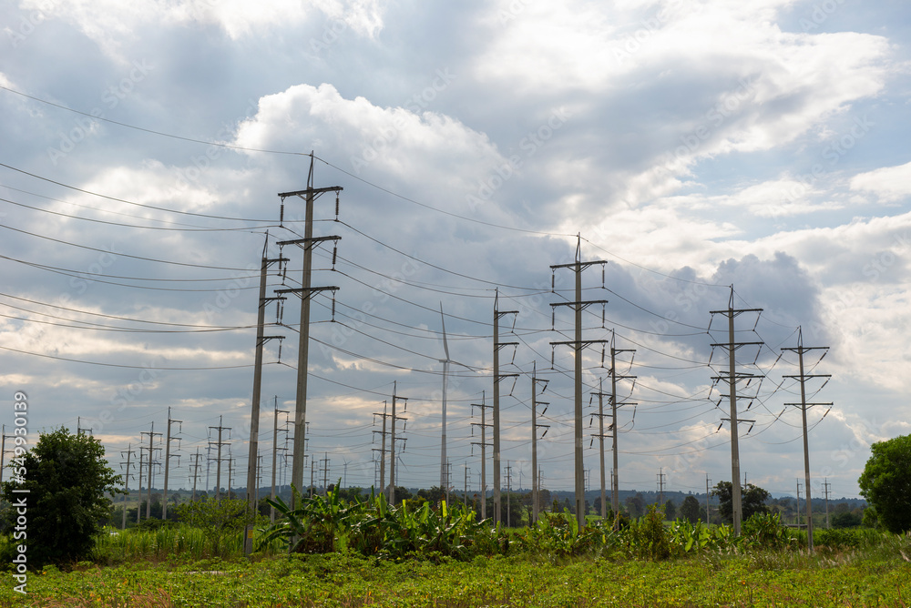A group of natural energy electric poles produced from wind turbines. Ideas to reduce global warming. A group of natural energy electric poles produced from wind turbines. Ideas to reduce global warming.