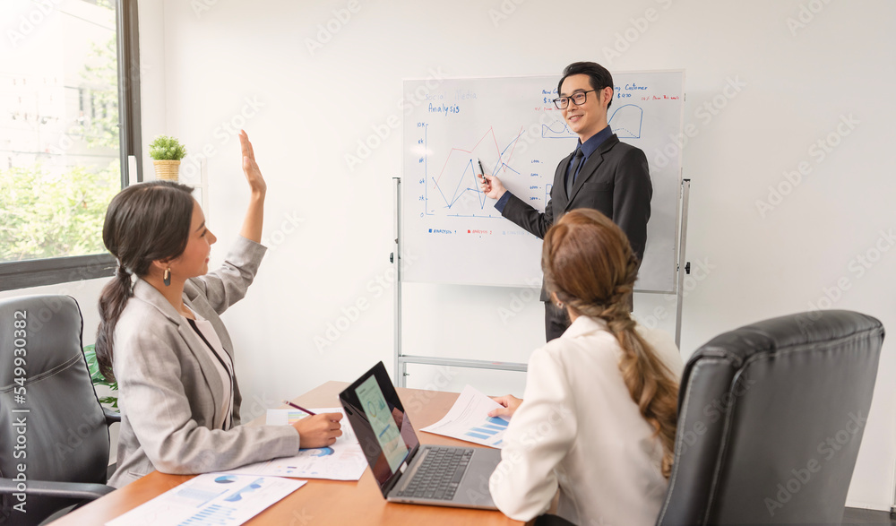 Asian businessman presenting of his work to corporate colleagues in meeting in office. businesspeople discussion during meeting about project of company. Asian businessman presenting of his work to corporate colleagues in meeting in office. businesspeople discussion during meeting about project of company.