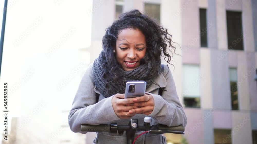Portrait of business young woman texting on smartphone outside office. Smiling girl having fun using a cellphone app. High quality 4k footage Portrait of business young woman texting on smartphone outside office. Smiling girl having fun using a cellphone app. High quality 4k footage