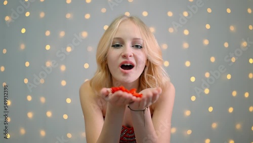 blonde teenage girl sends an air kiss, holiday, happiness, smiles.